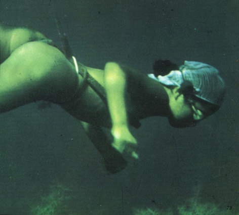 Underwater photo of a nude Asian fisherwoman