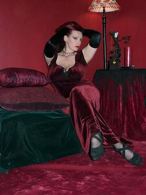 Gorgeous seductress in long velvet robe &  blood red  hair