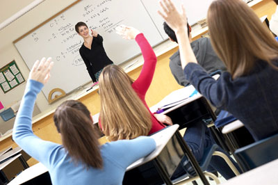 College classroom full of girls and a female professor