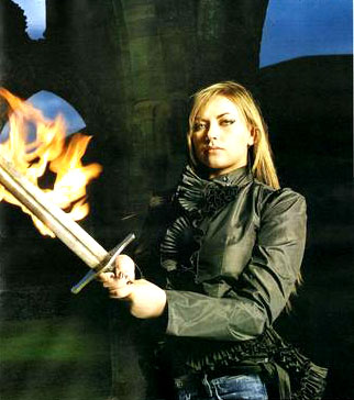 Mystical straight haired blonde in ruffles and flaming sword