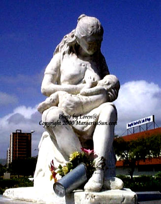 Statue of baby suckling at its Mother's breast