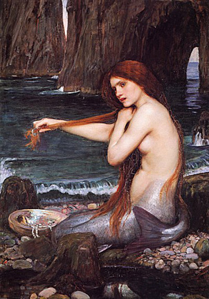 Painted depiction of mermaid, seductively topless, combing her hair on the beach