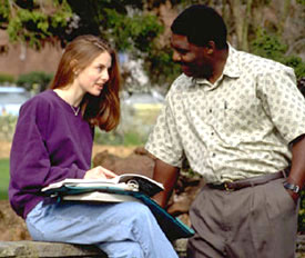Boy vs. girl. Two college students studying & chatting. Who's doing better?