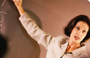 Female professor conducting class at the blackboard